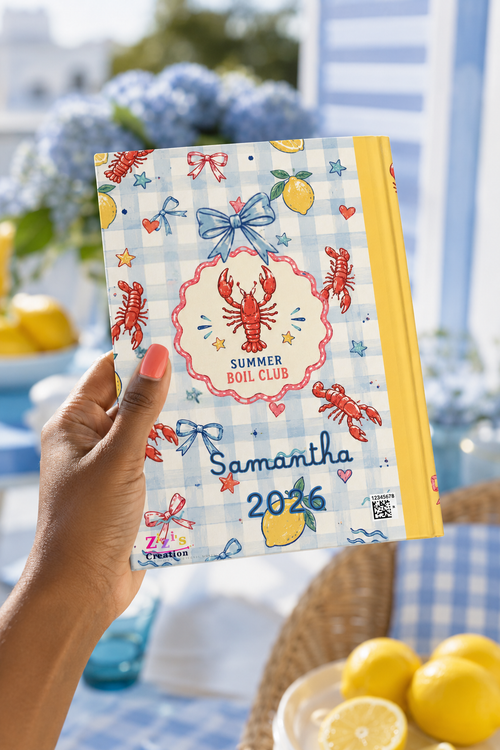 Summer Boil Club personalized journal held in a styled coastal lemon reading setting
