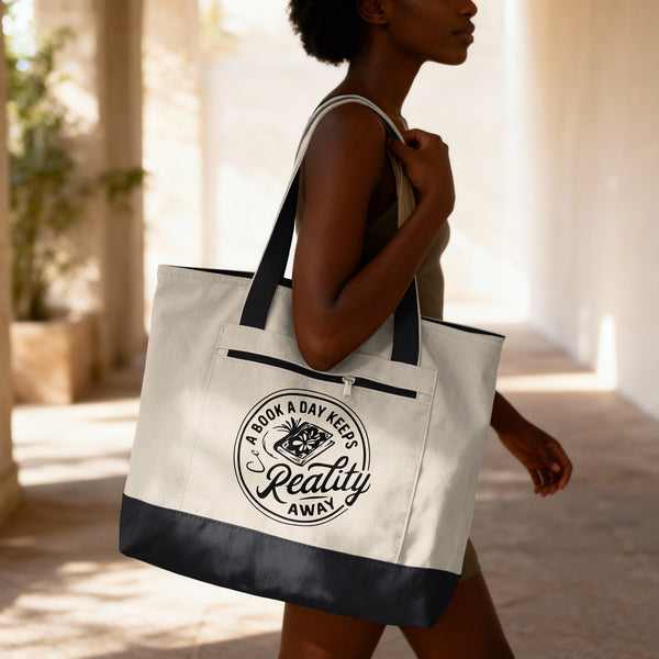 Woman carrying a natural canvas book lover tote bag with black handles and trim, featuring a book a day keeps reality away badge design