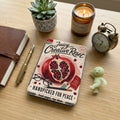 Juicy Creative Reset journal with a pomegranate, glasses, pencil, and text.