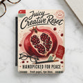Juicy Creative Reset journal cover with pomegranate illustration and text.