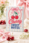 Notebook titled 'Cherry Sweet Notes' with cherries and a bow design on a decorative background.