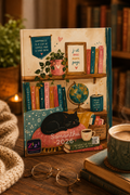 Calendar with bookshelf design featuring a cat, globe, and books on a wooden surface with a cup of coffee and glasses.