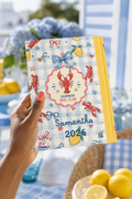 Summer Boil Club personalized journal held in a styled coastal lemon reading setting