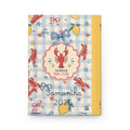 Notebook with lobster and checkered design on a white background