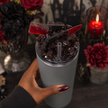 African American woman holding matte gray tumbler with horror knife removable magnetic 3D lid and burgundy
nails