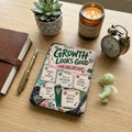 Journal with "Growth Looks Good" featuring five steps for personal development.