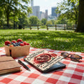 Juicy Creative Reset book with pomegranate illustration and picnic items on checkered blanket.